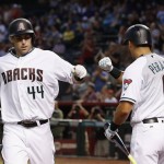 Arizona Diamondbacks' Paul Goldschmidt (44) celebrates his home run against the Colorado Rockies with David Peralta (6) during the first inning of a baseball game Tuesday, April 5, 2016, in Phoenix. (AP Photo/Ross D. Franklin)