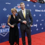 North Dakota State's Carson Wentz, right, poses for photos upon arriving for the first round of the 2016 NFL football draft at the Auditorium Theater of Roosevelt University, Thursday, April 28, 2016, in Chicago. (AP Photo/Nam Y. Huh)