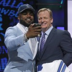 Ohio State's Ezekiel Elliott takes a selfie with NFL commissioner Roger Goodell after being selected by Dallas Cowboys as the fourth pick in the first round of the 2016 NFL football draft, Thursday, April 28, 2016, in Chicago. (AP Photo/Charles Rex Arbogast)