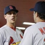 St. Louis Cardinals manager Mike Matheny, right, talks with Stephen Piscotty, left, in the dugout prior to a baseball game against the Arizona Diamondbacks on Monday, April 25, 2016, in Phoenix. (AP Photo/Ross D. Franklin)
