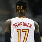 Atlanta Hawks guard Dennis Schroeder walks down the court with his initials and number dyed into his hair during the first half of an NBA game against the Phoenix Suns on Tuesday, April 5, 2016, in Atlanta. (AP Photo/John Bazemore)