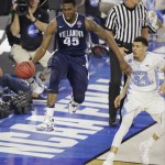 Villanova forward Darryl Reynolds (45) moves the ball as North Carolina forward Justin Jackson (44) looks on during the second half of the NCAA Final Four tournament college basketball championship game Monday, April 4, 2016, in Houston. (AP Photo/Charlie Neibergall)