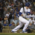Los Angeles Dodgers' Chase Utley follows through on a grounded that scored Howie Kendrick, in front of Arizona Diamondbacks catcher Welington Castillo, left, during the fifth inning of a baseball game in Los Angeles, Wednesday, April 13, 2016. Utley reached on an error. (AP Photo/Kelvin Kuo)