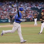 Chicago Cubs' Anthony Rizzo, left, tosses his bat away after drawing a walk by Arizona Diamondbacks' Zack Greinke, right, during the fourth inning of a baseball game Saturday, April 9, 2016, in Phoenix. (AP Photo/Ross D. Franklin)