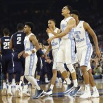 North Carolina players react to play against Villanova during the second half of the NCAA Final Four tournament college basketball championship game Monday, April 4, 2016, in Houston. (AP Photo/David J. Phillip)