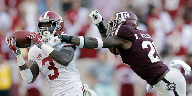 Alabama 's Calvin Ridley (3) pulls in a pass for a first down as Texas A&M 's Brandon Williams (21)...
