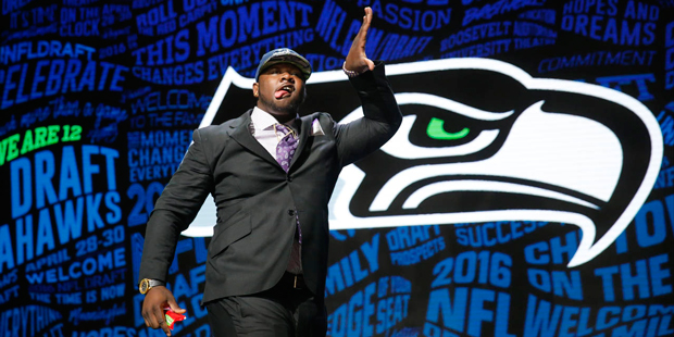 Alabama's Jarran Reed celebrates after being selected by the Seattle Seahawks as the 49th pick in t...