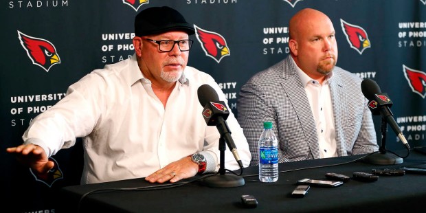 Arizona Cardinals head coach Bruce Arians, left, and general manager  Steve Keim discuss the upcomi...