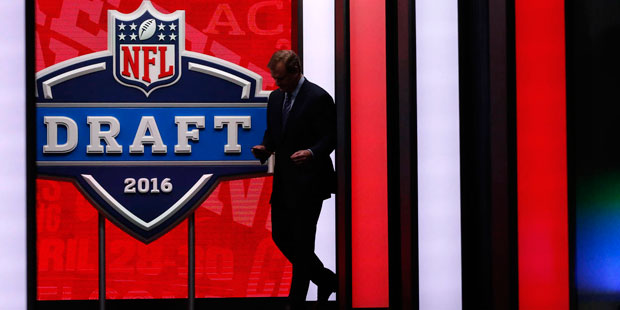 NFL Commissioner Roger Goodell walks out onto the stage to announce a pick during the first round o...