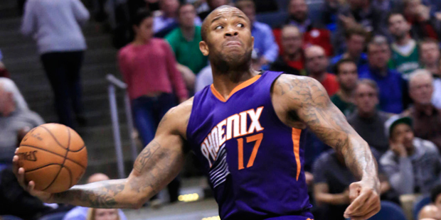 Phoenix Suns forward P.J. Tucker tries to save a loose ball during the second half of the team's NB...