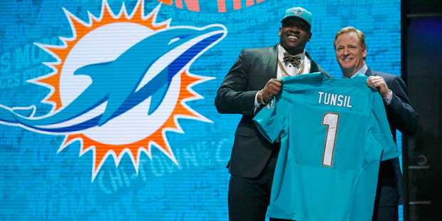 Mississippi's Laremy Tunsil poses for photos with NFL commissioner Roger Goodell after being select...