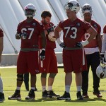 Offensive linemen watch during OTAs Tuesday, May 31. (Photo by Adam Green/Arizona Sports)