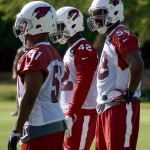 Linebackers Tristan Okpalaugo (58), Quayshawn Nealy (42) and Kevin Minter (51) wait during OTAs Tuesday, May 31. (Photo by Adam Green/Arizona Sports)