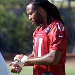 Receiver Larry FItzgerald gets taped up before taking the field for OTAs Tuesday, May 31. (Photo by Adam Green/Arizona Sports)