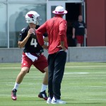QB Stephen Rivers goes through a drill while Byron Leftwich watches during Cardinals rookie mini-camp Friday, May 6. (Photo by Adam Green/Arizona Sports)