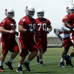 Offensive lineman run to the next drill during Cardinals rookie mini-camp Friday, May 6. (Photo by Adam Green/Arizona Sports)