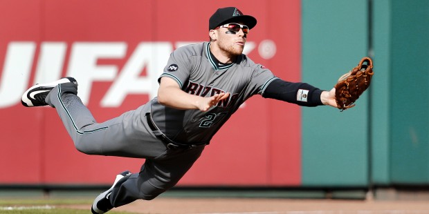 Arizona Diamondbacks right fielder Brandon Drury dives for but is unable to catch a foul ball by St...