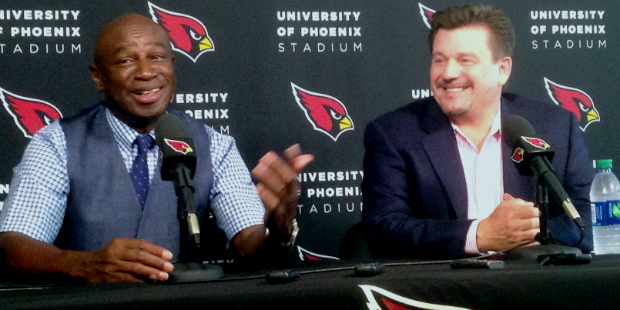 Roy Green (left) and Michael Bidwill share a laugh during a press conference to announce Green will...
