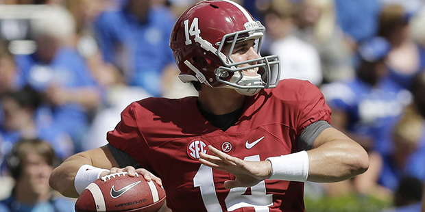 Alabama quarterback Jake Coker (14) sets back to throw the ball during an NCAA college football gam...