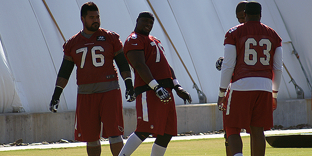 Linemen Mike Iupati, Earl Watford and Givens Price wait during OTAs. (Photo by Adam Green/Arizona S...