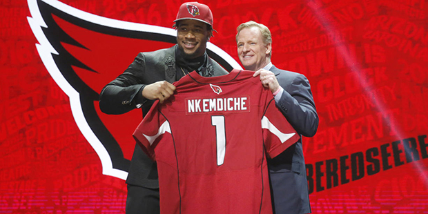 Mississippi’s Robert Nkemdiche poses for photos with NFL commissioner Roger Goodell after being s...