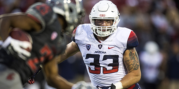 FILE - In this Oct. 25, 2014, file photo, Arizona linebacker Scooby Wright III (33) closes on Washi...
