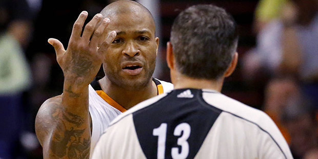 Phoenix Suns forward P.J. Tucker (17) argues a call with referee Monty McCutchen (13) during the se...