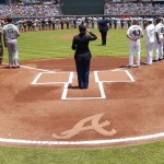 U.S. military members join the San Francisco Giants and Atlanta Braves on the field during a Memorial Day ceremony before a baseball game Monday, May 30, 2016, in Atlanta. (AP Photo/John Bazemore)