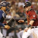 Arizona Diamondbacks Nick Ahmed, right, scores in front of San Diego Padres catcher Christian Bethancourt on a sacrifice bunt by Archie Bradley in the second inning during a baseball game, Sunday, May 29, 2016, in Phoenix. (AP Photo/Rick Scuteri)