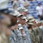 A U.S. military members line the the field during a Memorial Day ceremony before a baseball game between Atlanta Braves and San Francisco Giants on Monday, May 30, 2016, in Atlanta. (AP Photo/John Bazemore)