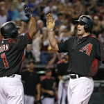 Arizona Diamondbacks' Paul Goldschmidt, right, celebrates his two-run home run against the San Diego Padres with Michael Bourn (1) during the second inning of a baseball game Saturday, May 28, 2016, in Phoenix. (AP Photo/Ross D. Franklin)