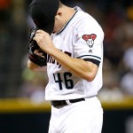 Arizona Diamondbacks starting pitcher Patrick Corbin (46) adjusts his cap after giving up a home run against the Houston Astros during the second inning of a baseball game, Tuesday, May 31, 2016, in Phoenix. (AP Photo/Matt York)