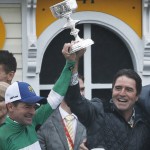 Jocky Kent Desormeaux, left, holds a trophy with his brother Keith Desormeaux after Exaggerator won  the 141st Preakness Stakes horse race at Pimlico Race Course, Saturday, May 21, 2016, in Baltimore.  (AP Photo/Matt Slocum)