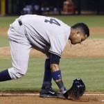New York Yankees' Starlin Castro slams his helmet down after striking out against the Arizona Diamondbacks during the fifth inning of a baseball game Wednesday, May 18, 2016, in Phoenix. (AP Photo/Ross D. Franklin)