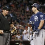 San Diego Padres' Brett Wallace, right, flips his bat away as he talks with umpire Brian Knight, after Knight called Wallace out on strikes during the third inning of a baseball game against the Arizona Diamondbacks on Friday, May 27, 2016, in Phoenix. (AP Photo/Ross D. Franklin)