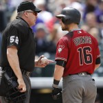 Arizona Diamondbacks' Chris Owings, right, argues with home plate umpire Bill Welke after he called out Owings on strikes while facing the Colorado Rockies to end the top of the fifth inning of a baseball game Wednesday, May 11, 2016, in Denver. (AP Photo/David Zalubowski)