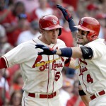 St. Louis Cardinals' Yadier Molina, right, is congratulated by teammate Stephen Piscotty after hitting a two-run home run during the seventh inning of a baseball game against the Arizona Diamondbacks, Saturday, May 21, 2016, in St. Louis. (AP Photo/Jeff Roberson)