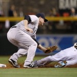 Arizona Diamondbacks' Paul Goldschmidt (44) slides safely into second base as New York Yankees' Chase Headley, left, misses the baseball for a field error during the first inning of a baseball game Tuesday, May 17, 2016, in Phoenix. The Diamondbacks' Goldschmidt advanced to third base on the play. (AP Photo/Ross D. Franklin)