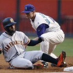 San Francisco Giants' Denard Span, left, slides safely back into first base after connecting for a single as Arizona Diamondbacks' Paul Goldschmidt, right, applies a late tag during the first inning of a baseball game Thursday, May 12, 2016, in Phoenix. (AP Photo/Ross D. Franklin)