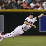 Arizona Diamondbacks' Nick Ahmed dives in vain for a line drive hit by New York Yankees' Aaron Hicks, for a single, during the ninth inning of a baseball game Monday, May 16, 2016, in Phoenix. The Diamondbacks defeated the Yankees 12-2. (AP Photo/Ross D. Franklin)
