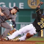 Pittsburgh Pirates' Gregory Polanco (25) slides safely into second with a stolen base ahead of the tag by Arizona Diamondbacks second baseman Brandon Drury during the third inning of a baseball game in Pittsburgh, Wednesday, May 25, 2016. (AP Photo/Gene J. Puskar)