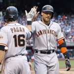 San Francisco Giants' Hunter Pence, right, smiles as he celebrates his two-run home run against the Arizona Diamondbacks with Angel Pagan (16) during the fourth inning of a baseball game Saturday, May 14, 2016, in Phoenix. (AP Photo/Ross D. Franklin)