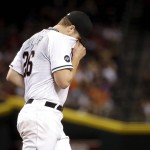 Arizona Diamondbacks starting pitcher Shelby Miller (26) wipes his face during the sixth inning of a baseball game against the San Francisco Giants, Friday, May 13, 2016, in Phoenix. (AP Photo/Matt York)