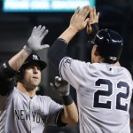 New York Yankees' Brett Gardner, left, celebrates his two-run home run against the Arizona Diamondbacks with Jacoby Ellsbury (22) during the first inning of a baseball game Wednesday, May 18, 2016, in Phoenix. (AP Photo/Ross D. Franklin)