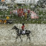 A horse moves along a muddy track after rain ahead the 141st Preakness Stakes horse race at Pimlico Race Course, Saturday, May 21, 2016, in Baltimore.  (AP Photo/Matt Slocum)