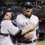 New York Yankees pitcher Dellin Betances, right, shouts in celebration after striking out Arizona Diamondbacks' Brandon Drury, as Betances gets a slap on the chest from catcher Brian McCann during the seventh inning of a baseball game Wednesday, May 18, 2016, in Phoenix. (AP Photo/Ross D. Franklin)
