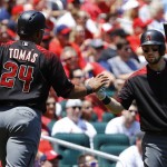 Arizona Diamondbacks' Yasmany Tomas is congratulated by Chris Owings, right, after scoring on a single by Brandon Drury during the first inning of a baseball game against the St. Louis Cardinals, Sunday, May 22, 2016, in St. Louis. (AP Photo/Billy Hurst)