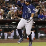 San Diego Padres' Yangervis Solarte claps and jumps as he arrives at home plate after hitting a home run against the Arizona Diamondbacks during the fifth inning of a baseball game Friday, May 27, 2016, in Phoenix. (AP Photo/Ross D. Franklin)