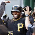 Pittsburgh Pirates' Gregory Polanco, center, celebrates in the dugout after hitting a three run home run off Arizona Diamondbacks starting pitcher Shelby Miller during the first inning of a baseball game in Pittsburgh, Tuesday, May 24, 2016. (AP Photo/Gene J. Puskar)