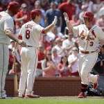 St. Louis Cardinals' Jedd Gyorko, right, is congratulated by teammates Mike Leake and Matt Adams, left, after hitting a two-run home run during the second inning of a baseball game against the Arizona Diamondbacks, Saturday, May 21, 2016, in St. Louis. (AP Photo/Jeff Roberson)